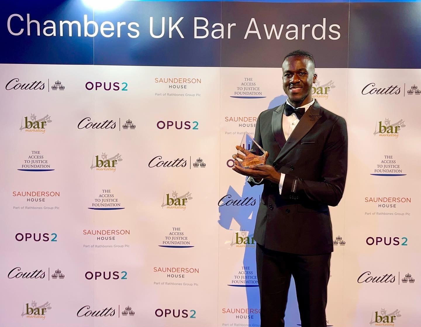 Mass Ndow-Njie holding his Chambers UK Bar Award